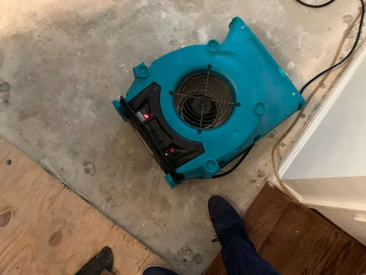 Air mover drying subfloor during Leak Detection & Repair in Oak Creek